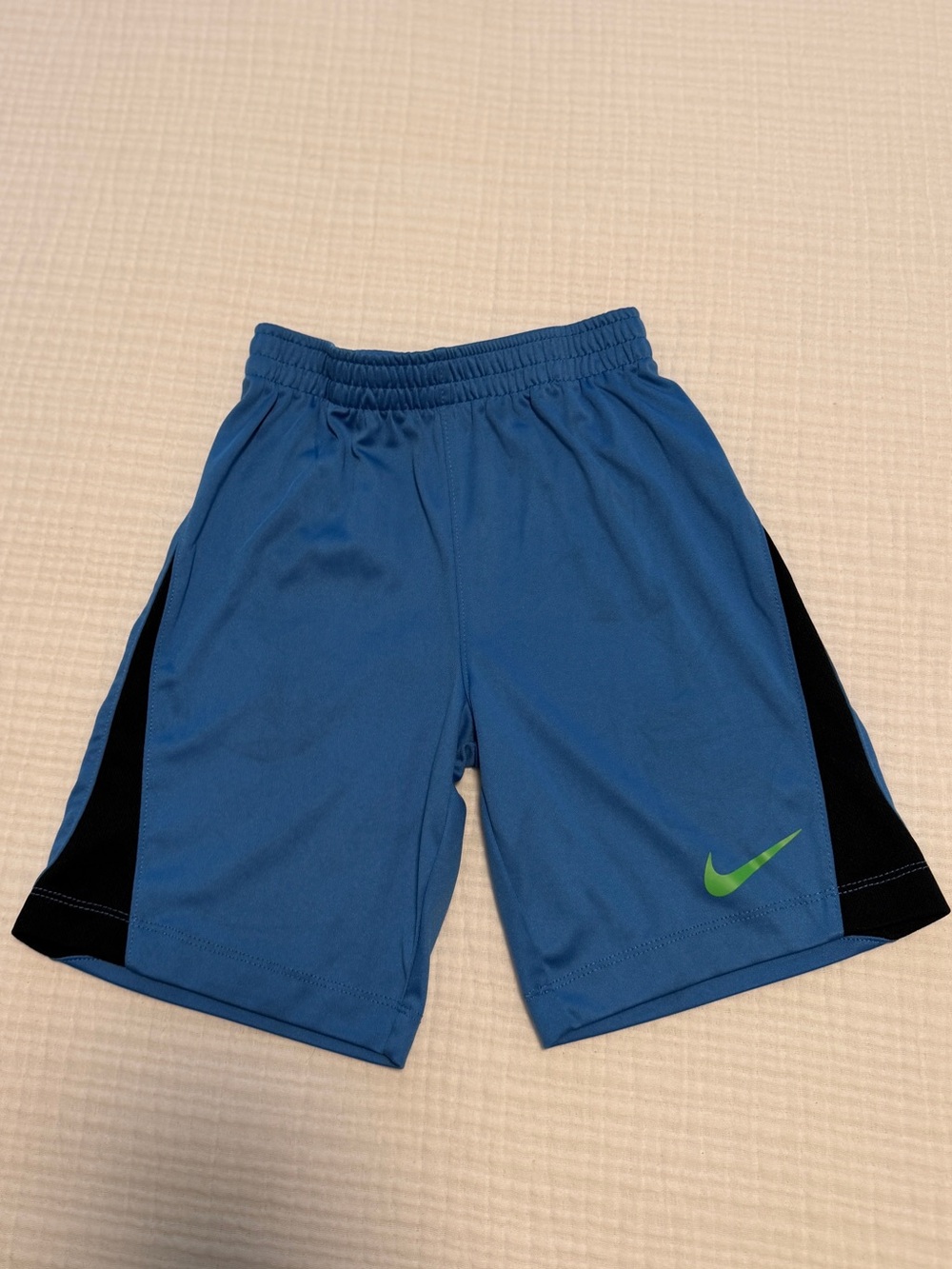 Nike Dri-Fit Blue Athletic Shorts with Black Side Panels and Neon Green Swoosh